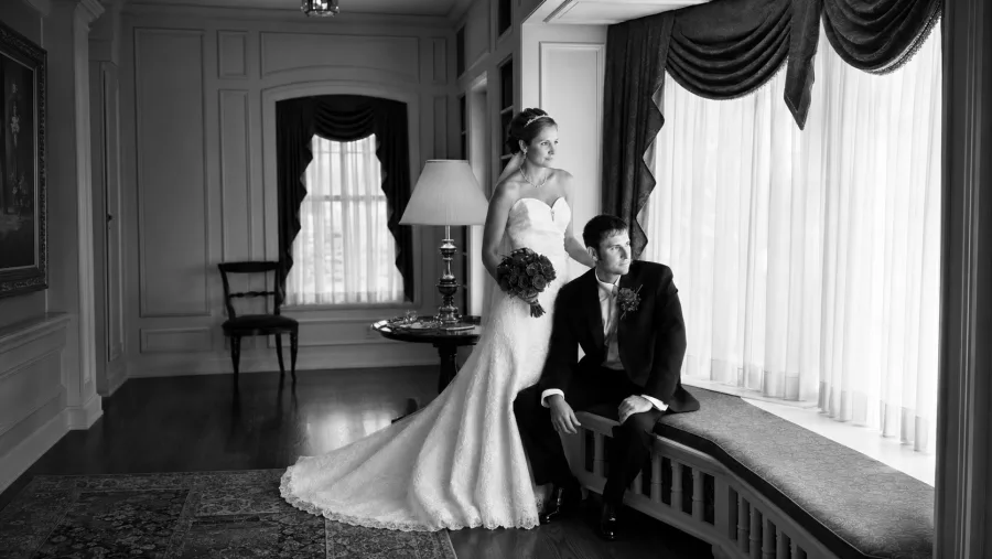 An elegant couple inside the historic Montague Inn