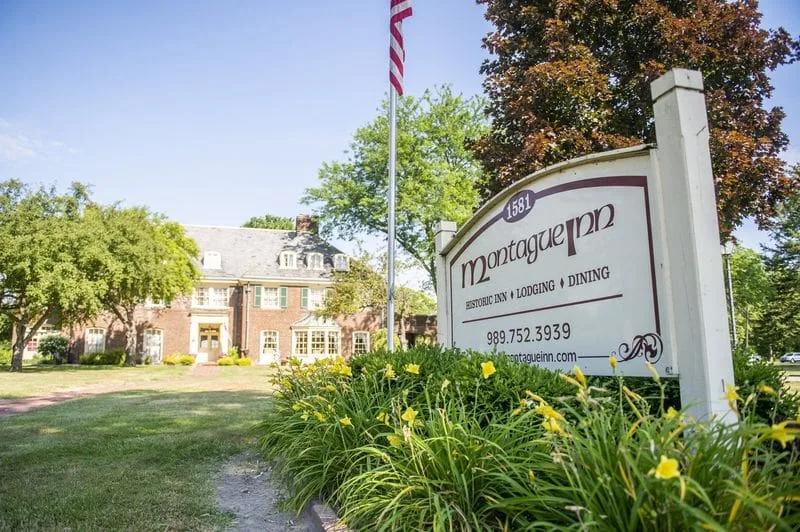 The Montague Inn’s welcome sign and mansion on South Washington Avenue